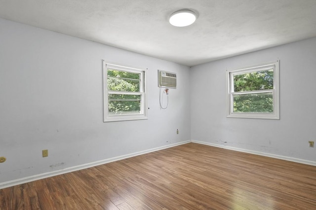 2-4 Founders Rd, Shrewsbury, MA 01545 - empty room featuring wood finished floors and an AC wall unit