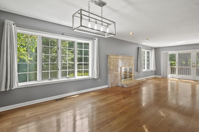 2-4 Founders Rd, Shrewsbury, MA 01545 - unfurnished living room with wood finished floors and a premium fireplace
