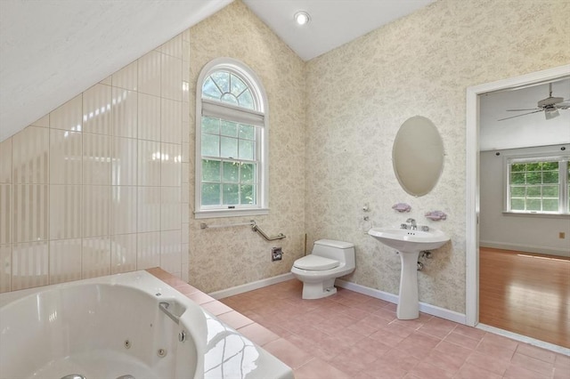 2-4 Founders Rd, Shrewsbury, MA 01545 - full bath with healthy amount of natural light, a jetted tub, lofted ceiling, wallpapered walls, and tile patterned flooring