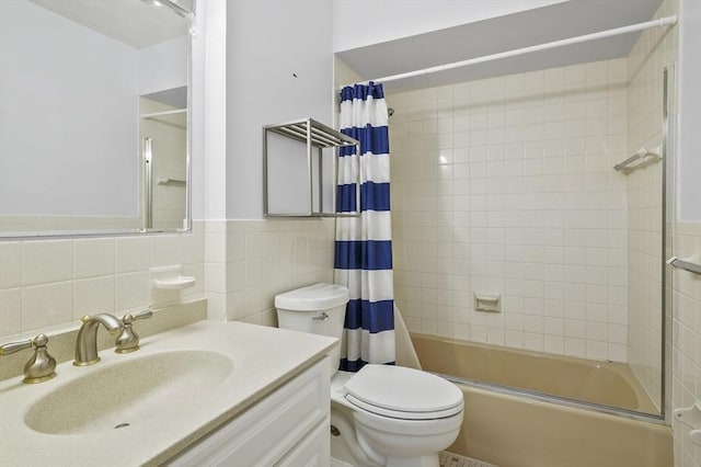 2-4 Founders Rd, Shrewsbury, MA 01545 - full bathroom featuring shower / tub combo, tile walls, vanity, and wainscoting