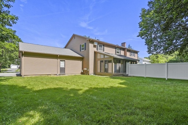 2-4 Founders Rd, Shrewsbury, MA 01545 - rear view of house with a chimney and a sunroom