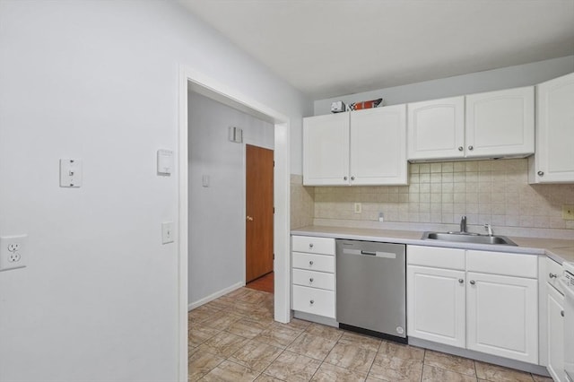 2-4 Founders Rd, Shrewsbury, MA 01545 - kitchen with stainless steel dishwasher, white cabinets, light countertops, and decorative backsplash