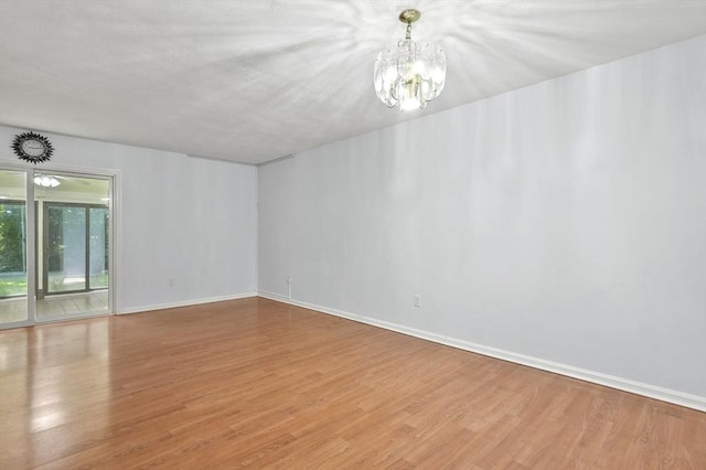 2-4 Founders Rd, Shrewsbury, MA 01545 - empty room featuring wood finished floors and a chandelier