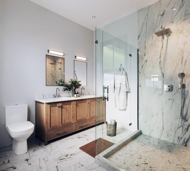 bathroom with a tile shower, vanity, and toilet