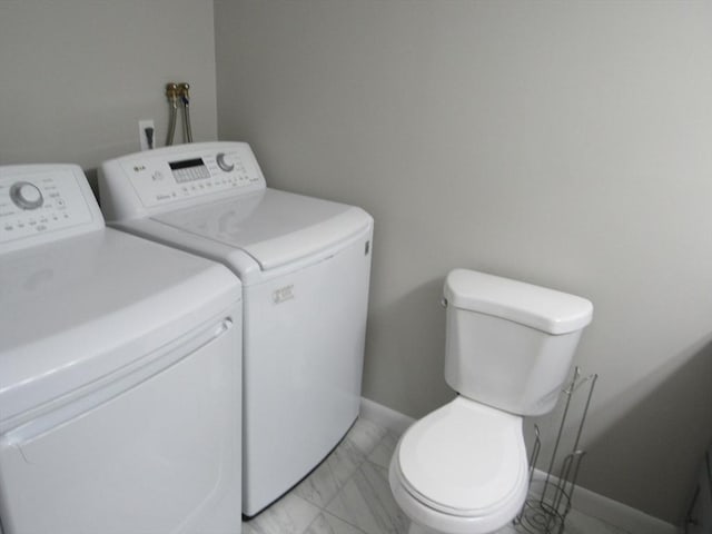 laundry room with washer and dryer