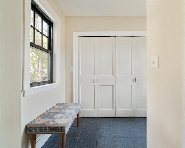 interior space with dark tile patterned floors