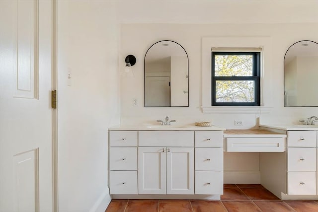 full bath featuring a sink, tile patterned flooring, and two vanities