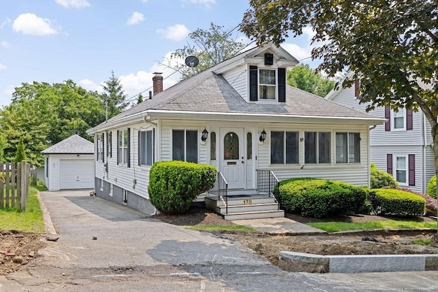 178 Elliot Ave, Quincy, MA 02171 - bungalow with a detached garage, an outdoor structure, a chimney, asphalt driveway, and roof with shingles
