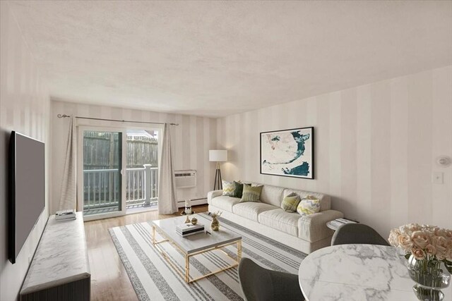 205 Independence Ave Unit 223, Quincy, MA 02169 - living room featuring wallpapered walls, wood finished floors, a baseboard heating unit, and an AC wall unit