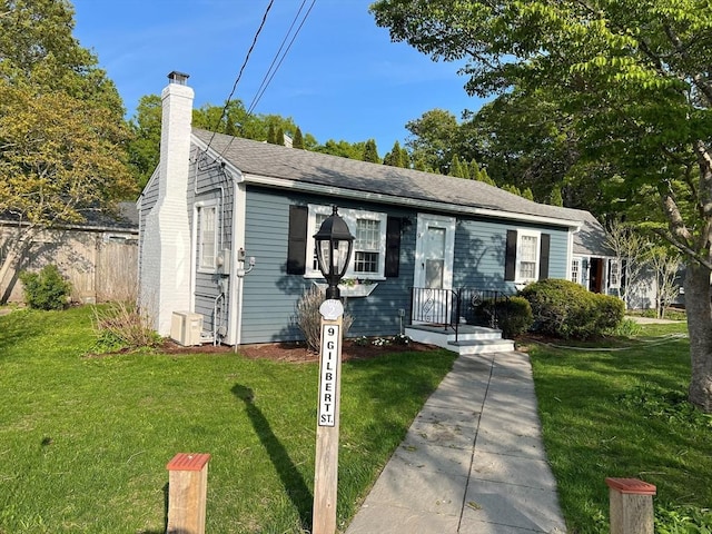 bungalow-style house with a front yard