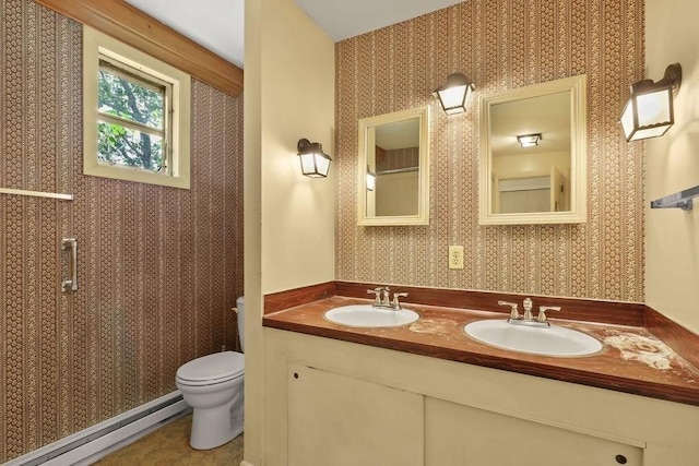 155 Glen Charlie Rd, Wareham, MA 02538 - bathroom with a baseboard radiator, wallpapered walls, and double vanity