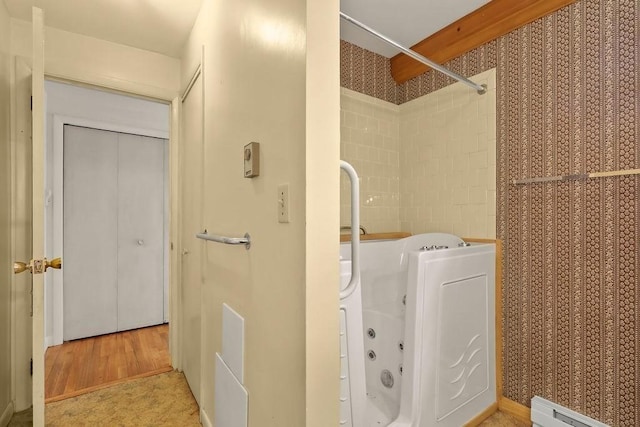 155 Glen Charlie Rd, Wareham, MA 02538 - laundry room featuring a baseboard radiator and light wood-style flooring