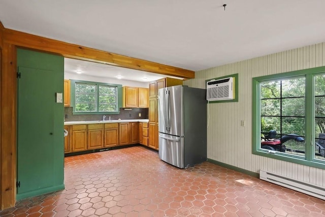 155 Glen Charlie Rd, Wareham, MA 02538 - kitchen with freestanding refrigerator, a baseboard radiator, light countertops, beamed ceiling, and a wall unit AC