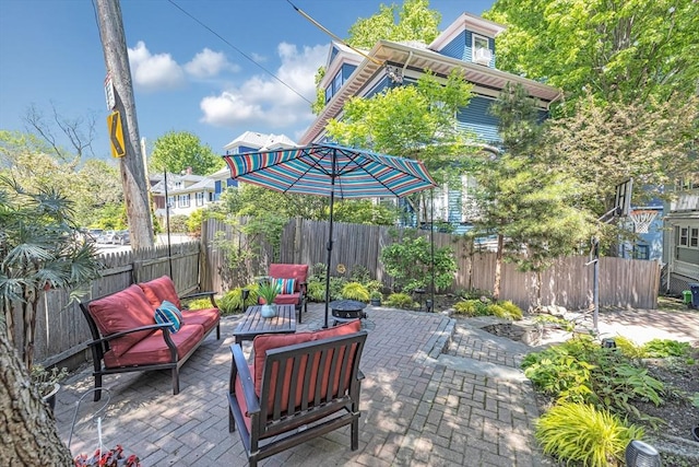 view of patio featuring a fenced backyard and an outdoor living space