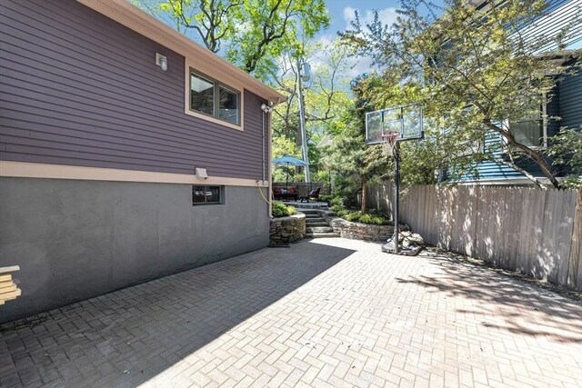 view of patio featuring fence
