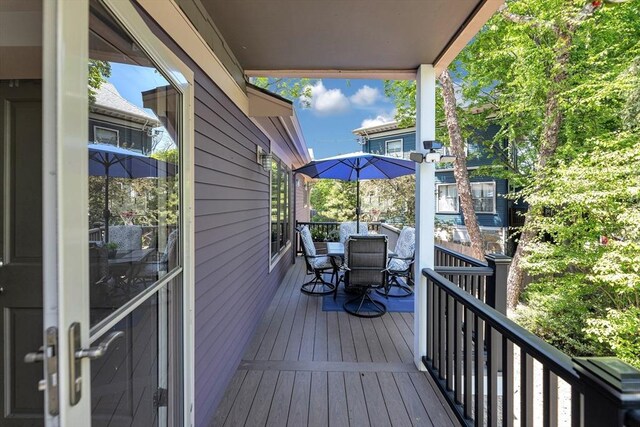 wooden deck with outdoor dining area