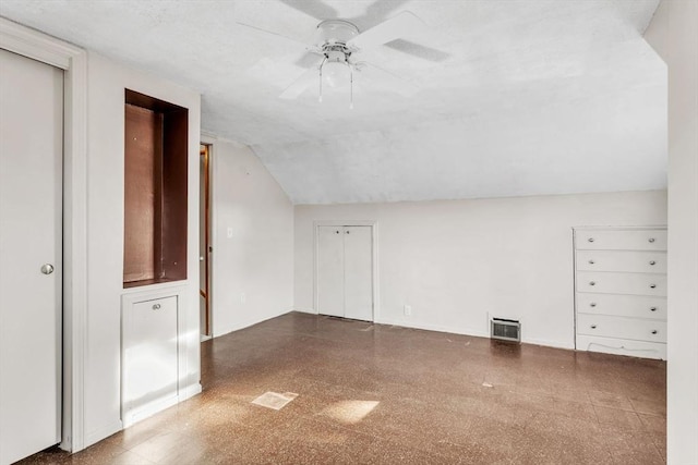 additional living space featuring ceiling fan and vaulted ceiling