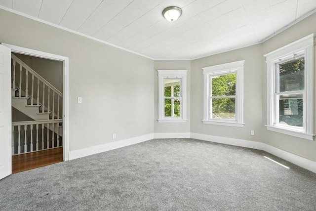 782 Sumner Ave, Springfield, MA 01108 - spare room featuring carpet flooring, ornamental molding, and stairs
