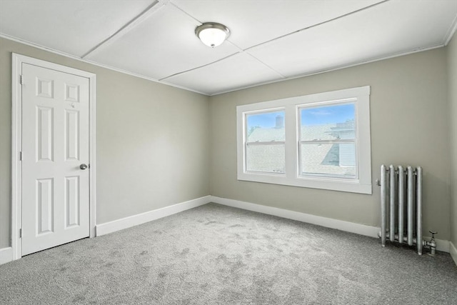 782 Sumner Ave, Springfield, MA 01108 - carpeted empty room featuring radiator heating unit and baseboards