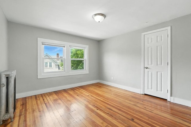 782 Sumner Ave, Springfield, MA 01108 - unfurnished room featuring radiator heating unit and light wood-style flooring