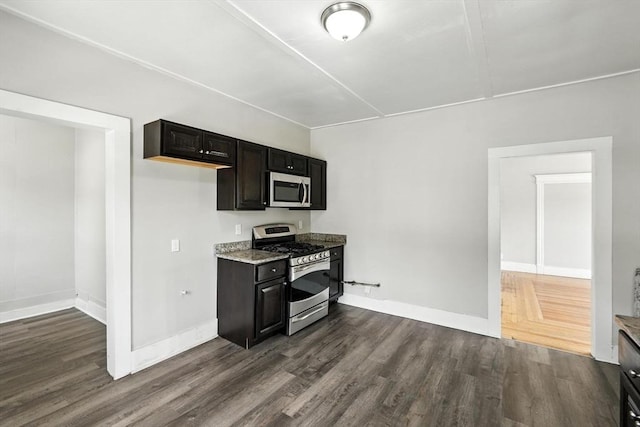 782 Sumner Ave, Springfield, MA 01108 - kitchen with appliances with stainless steel finishes, dark wood finished floors, and light stone countertops