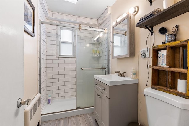 24 Central St, Somerville, MA 02143 - full bathroom with radiator heating unit, healthy amount of natural light, and a stall shower