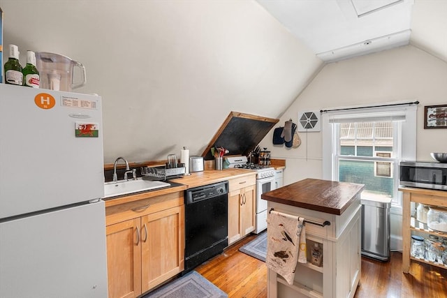 24 Central St, Somerville, MA 02143 - kitchen with white appliances, butcher block counters, a sink, vaulted ceiling, and wood finished floors