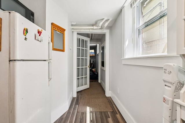 24 Central St, Somerville, MA 02143 - hall featuring healthy amount of natural light, baseboards, and dark wood-type flooring