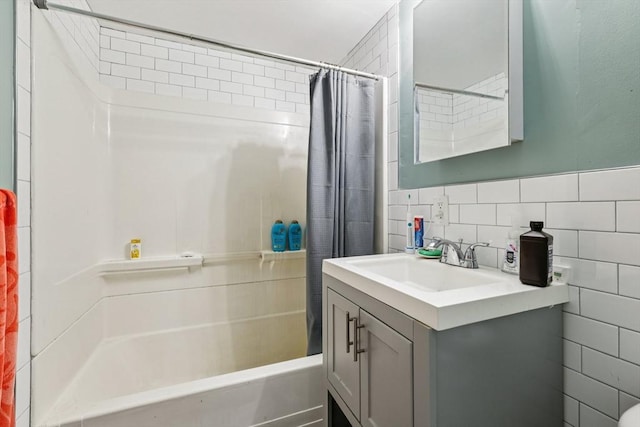 24 Central St, Somerville, MA 02143 - bathroom featuring shower / tub combo with curtain, vanity, and tile walls