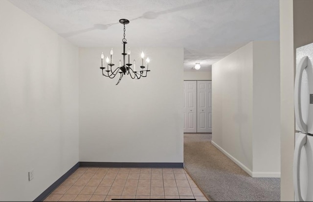 9 Davis Rd Unit C10, Acton, MA 01720 - unfurnished room with a chandelier and light tile patterned floors
