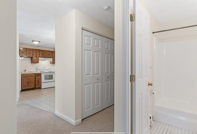 9 Davis Rd Unit C10, Acton, MA 01720 - hall with light tile patterned floors and light carpet