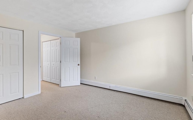 9 Davis Rd Unit C10, Acton, MA 01720 - unfurnished bedroom with carpet and a baseboard heating unit