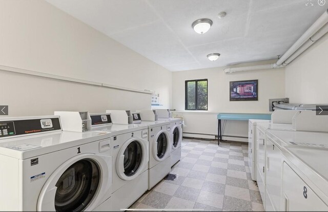 9 Davis Rd Unit C10, Acton, MA 01720 - community laundry room featuring washing machine and dryer, light flooring, and baseboard heating