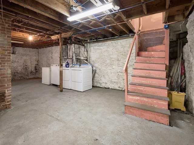 basement with washer and clothes dryer