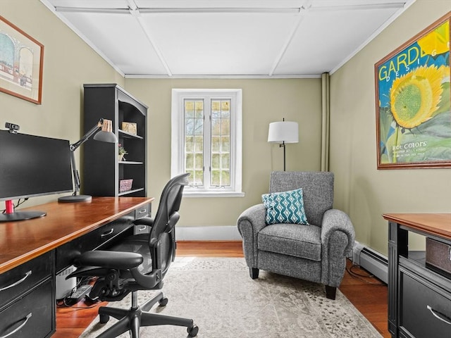 home office with baseboards, crown molding, wood finished floors, and baseboard heating