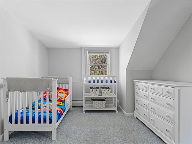 carpeted bedroom with baseboards, a baseboard heating unit, and a nursery area