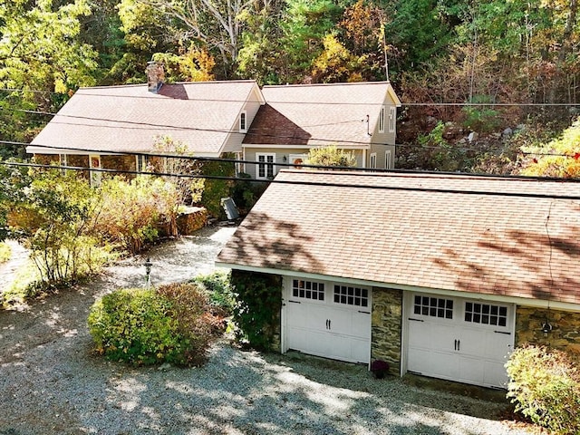 exterior space featuring a forest view and fence