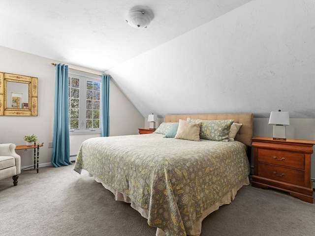 carpeted bedroom with baseboards, a baseboard heating unit, and lofted ceiling