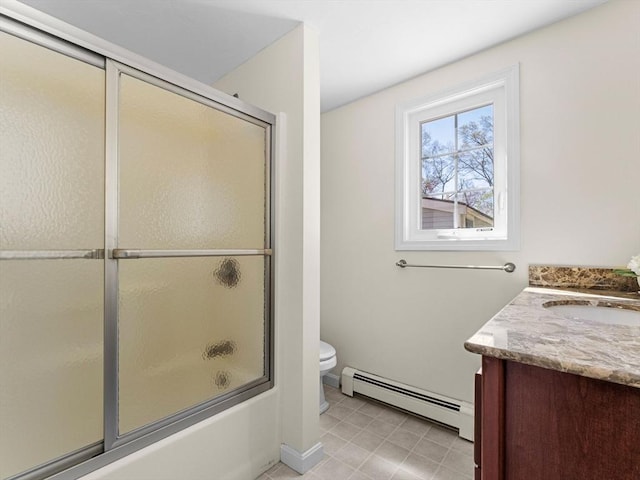 full bathroom with vanity, tile patterned flooring, shower / bath combination with glass door, toilet, and a baseboard heating unit
