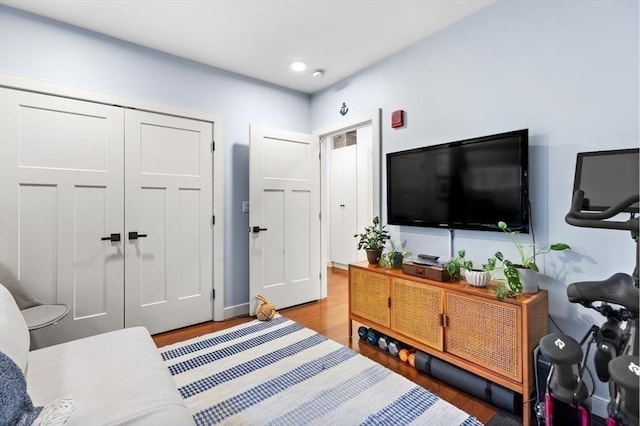 bedroom featuring a closet and light hardwood / wood-style flooring