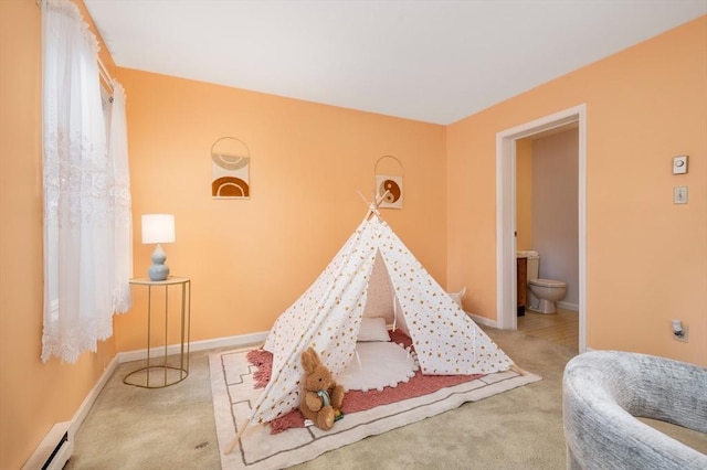 game room featuring light carpet and baseboard heating