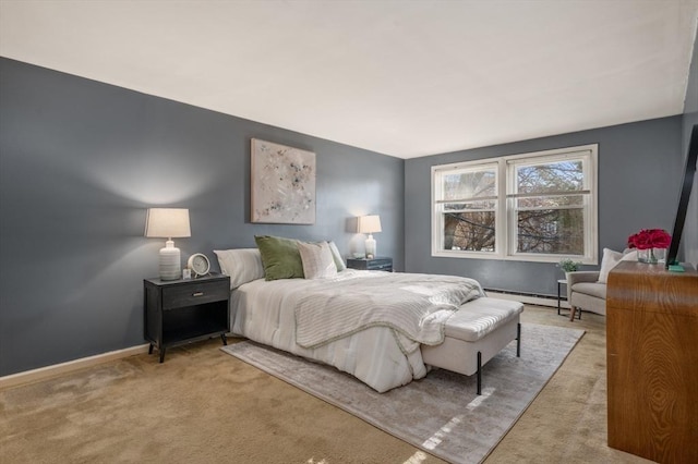 bedroom with light colored carpet and baseboard heating