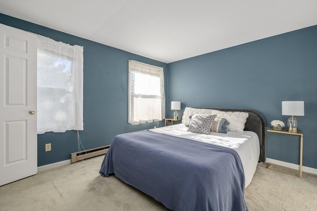 carpeted bedroom with baseboard heating