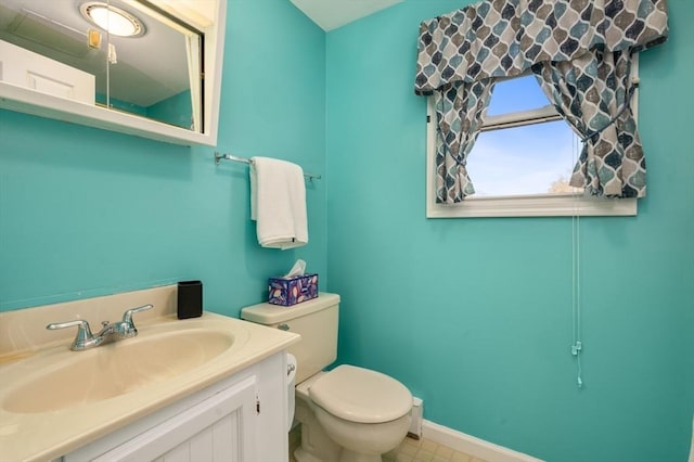 bathroom featuring toilet and vanity