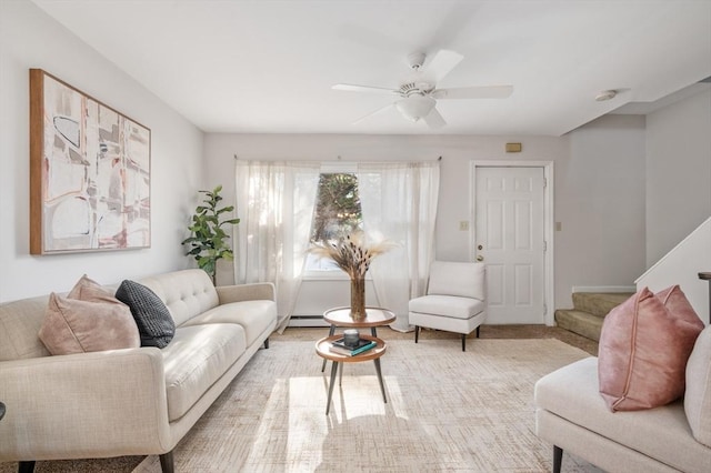 living room with ceiling fan and a baseboard radiator