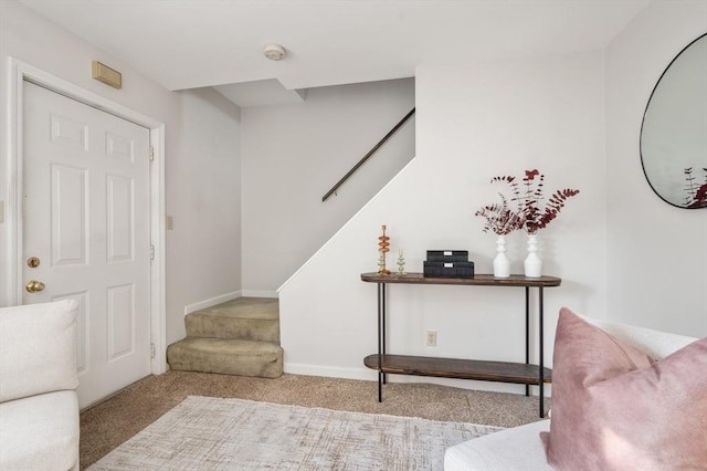 view of carpeted entrance foyer