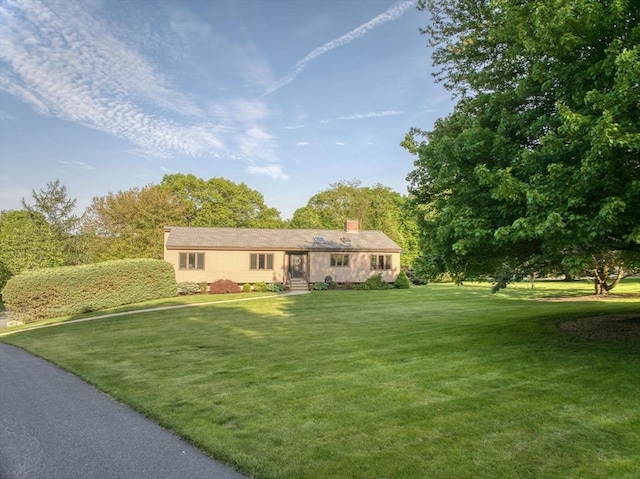 34 Marlboro St, Hudson, MA 01749 - view of front of house with a front lawn and a chimney