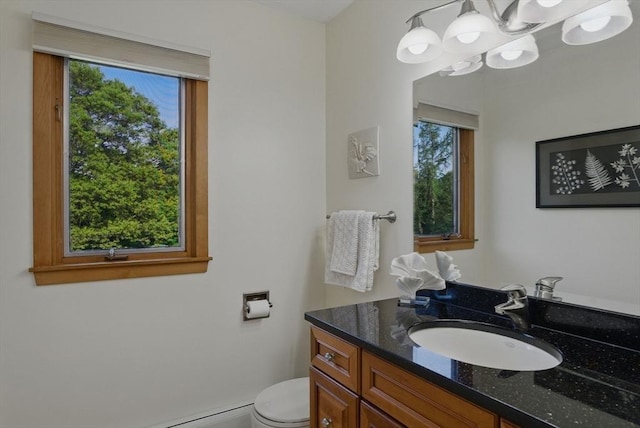 34 Marlboro St, Hudson, MA 01749 - half bathroom with vanity, a chandelier, and toilet