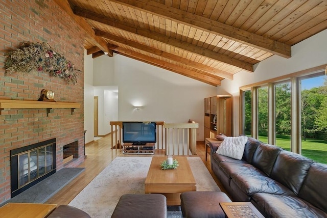 34 Marlboro St, Hudson, MA 01749 - living area with wooden ceiling, beamed ceiling, a fireplace, wood finished floors, and high vaulted ceiling