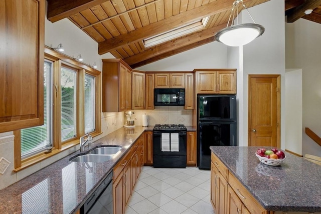 34 Marlboro St, Hudson, MA 01749 - kitchen featuring black appliances, a sink, a skylight, decorative backsplash, and light tile patterned floors